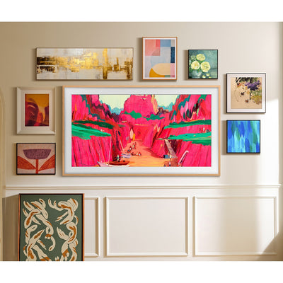 Samsung The Frame Pro 4K Vision AI Smart TV mounted surrounded by more wall art